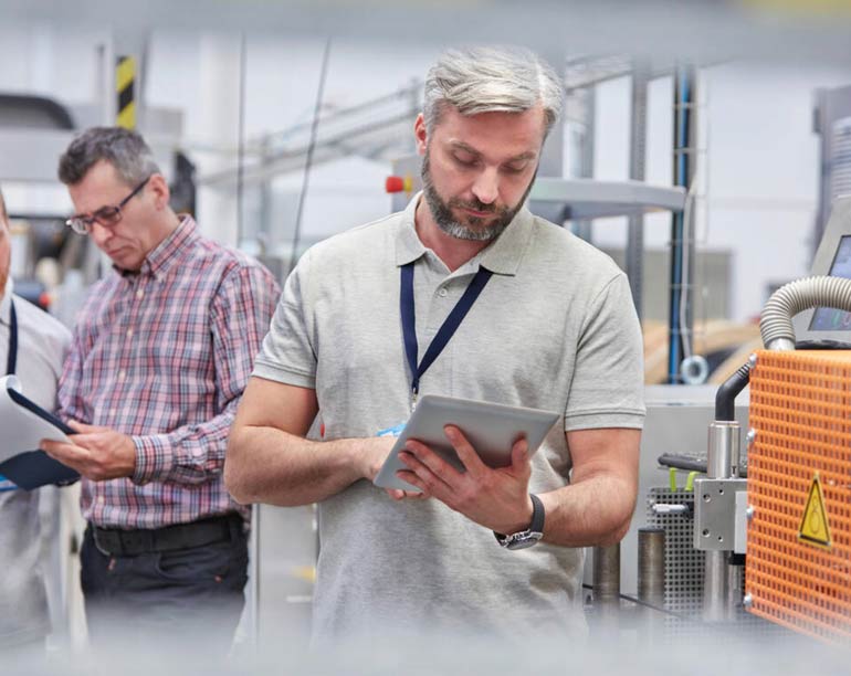 employees using Synergy to track work